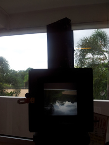 Camera and the inverted image from the beautiful skyscape outside the studio
