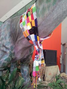yarnbombed dinosaur