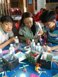 Mother and children taking the idea of a basic ciruit and making intersting things 